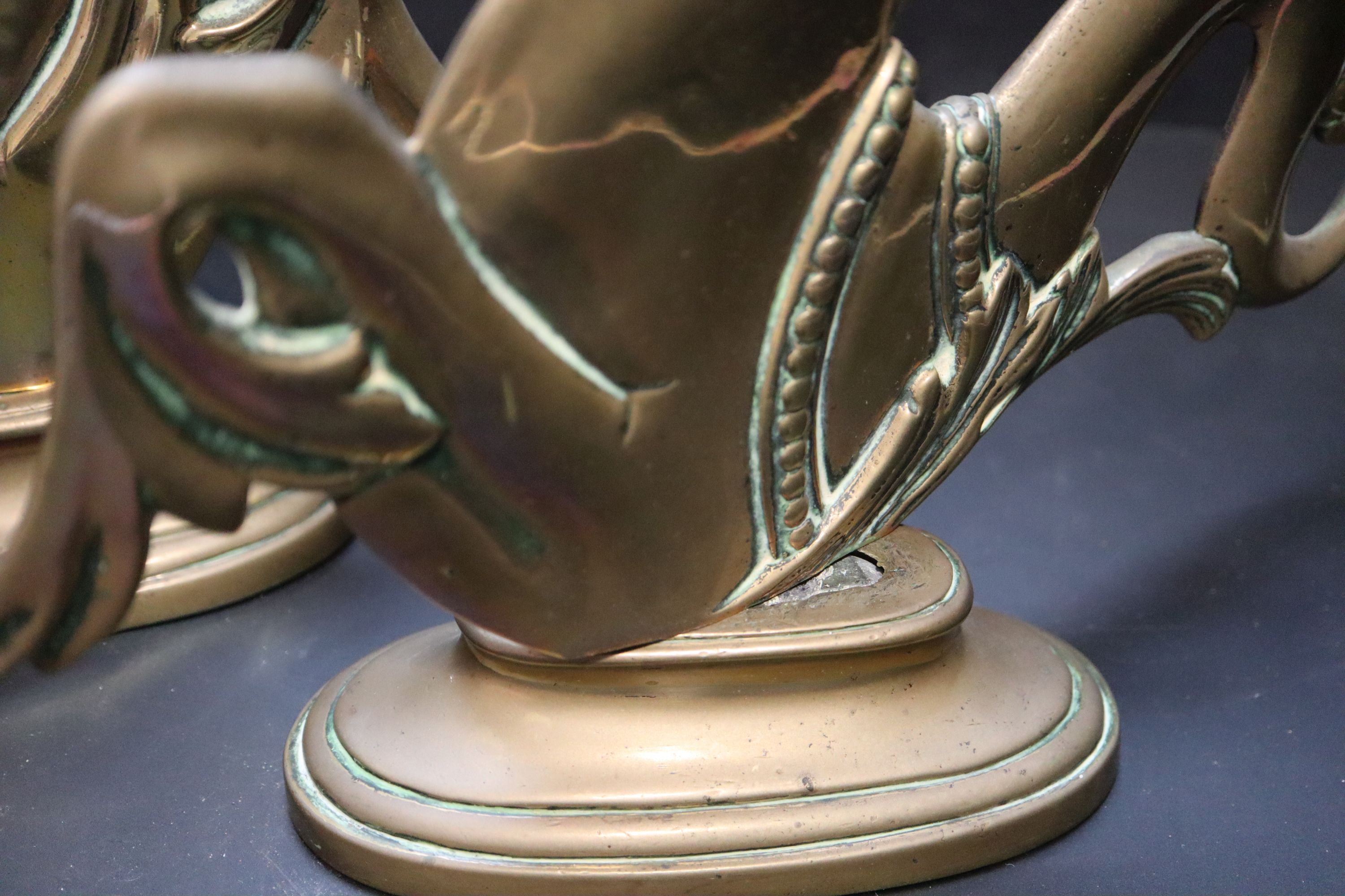 A pair of Venetian brass seahorse gondola finials, height 31cm